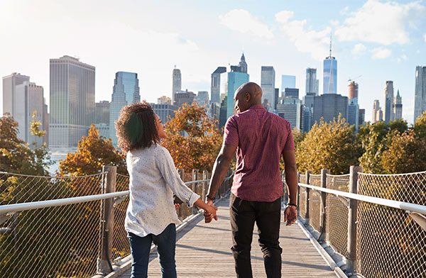 A couple holding hands on a walk