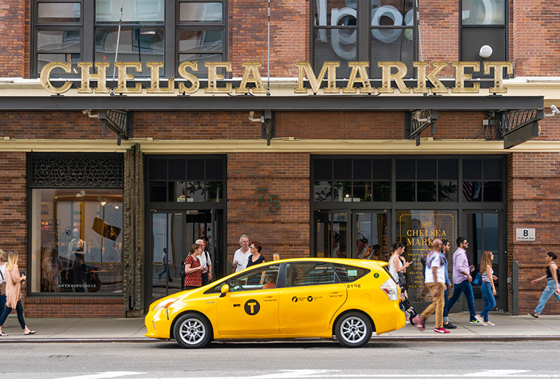 Tax parked infront of Chelsea Market entrance